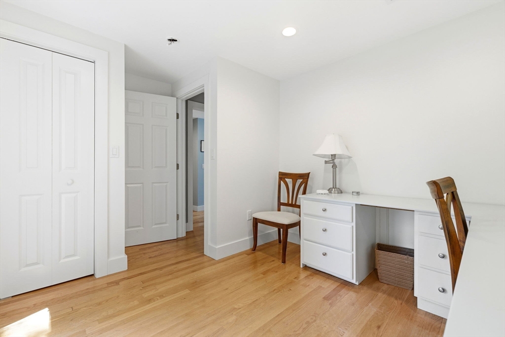 35 Keyes Road Westford, MA 01886 - Photo 26 of 40 a view of a workspace with furniture and wooden floor