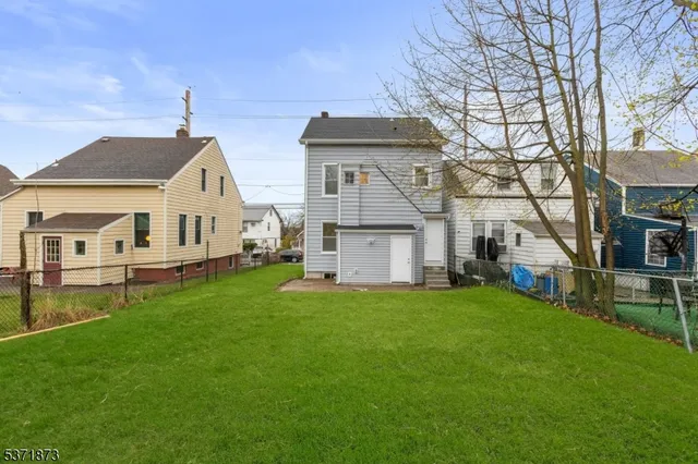 a front view of house with yard and seating area