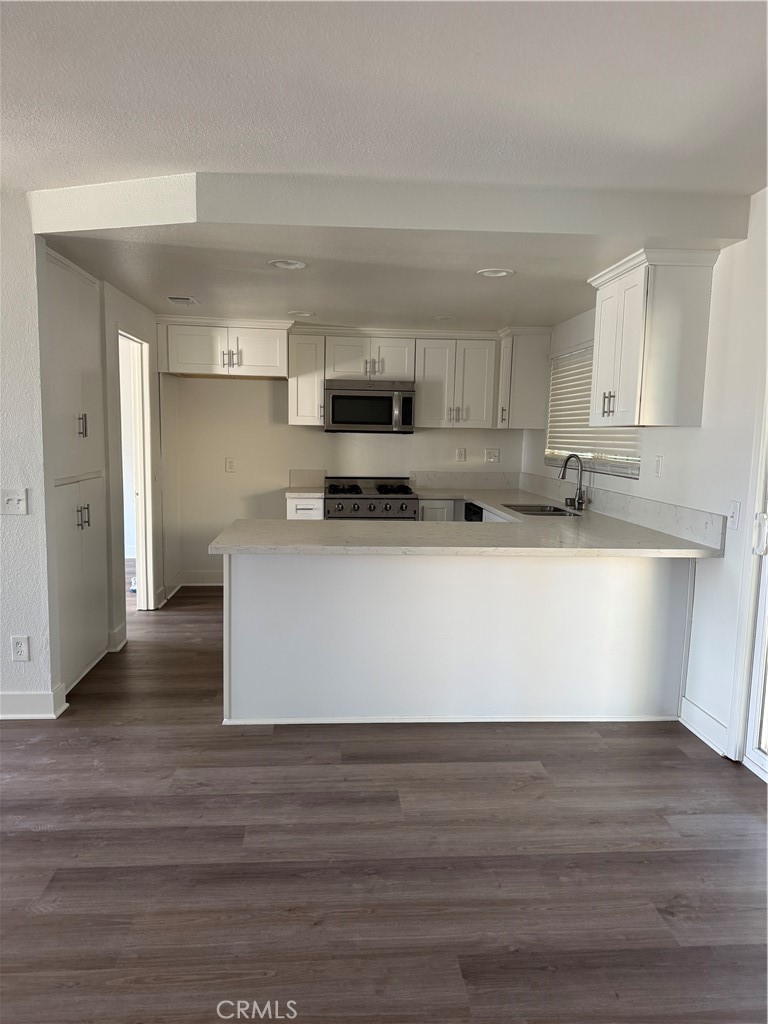 15521 Saddleback Road Riverside, CA 92506 - Photo 4 of 8 a view of kitchen with stainless steel appliances granite countertop a stove a sink and a refrigerator