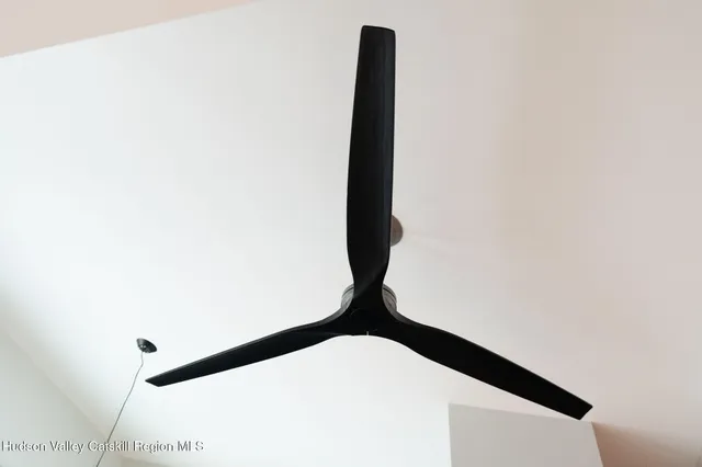 a view of livingroom with floor to ceiling window and stairs