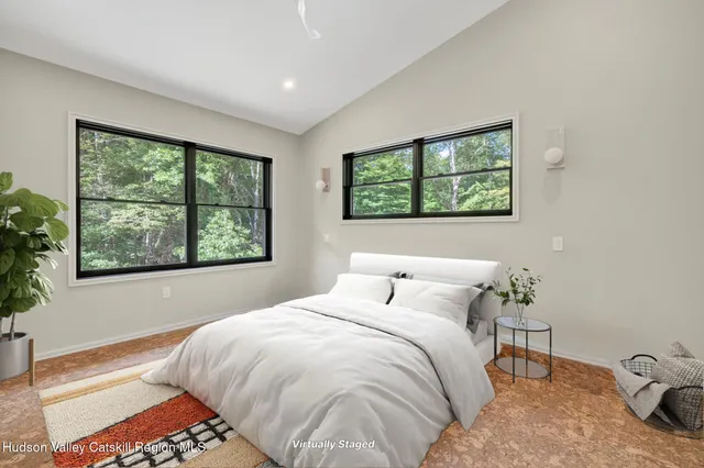 a bathroom with a sink mirror and toilet