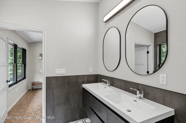 an empty room with staircase and white walls