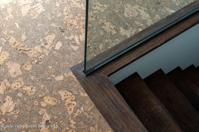 a bedroom with a large bed and a large window