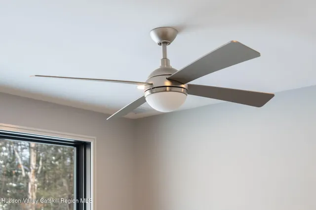 a room with furniture pool table and windows