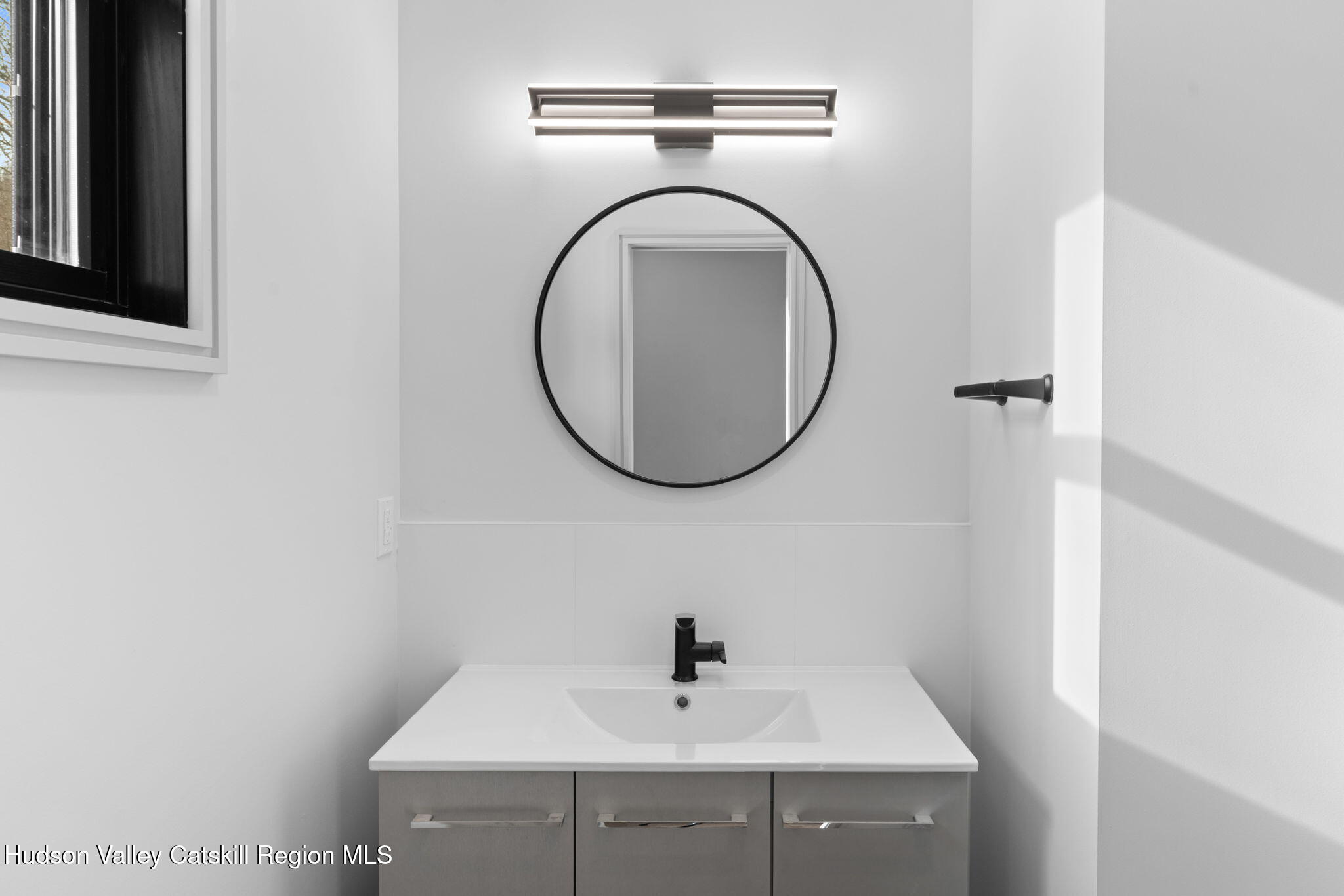 178 Chestnut Hill Road Woodstock, NY 12498 - Photo 35 of 42 a bathroom with a sink and a mirror