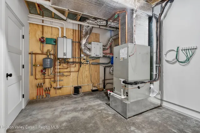 a view of a backyard with plants and outdoor seating