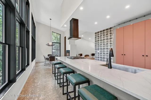 a large kitchen with a table and chairs