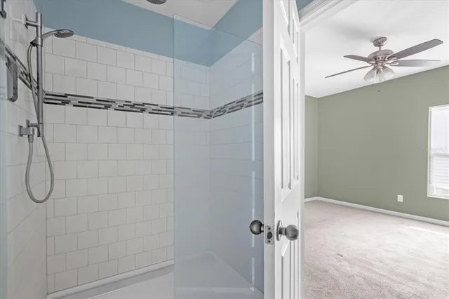 a bathroom that has a glass shower door