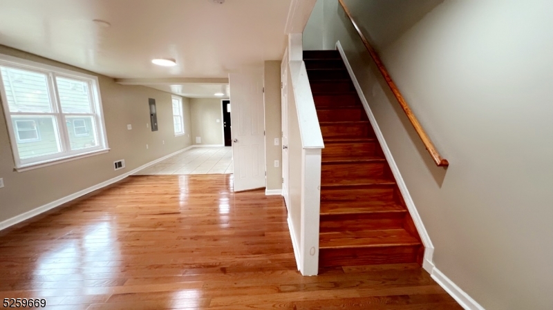 a view of entryway with wooden floor