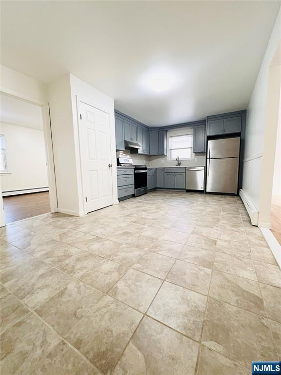 a view of a kitchen with a sink cabinets and a window
