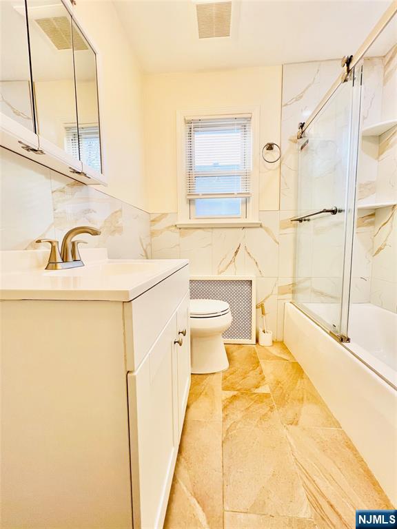 76 Front Street, Unit 2 North Arlington, NJ 07031 - Photo 9 of 13 a bathroom with a sink and a toilet