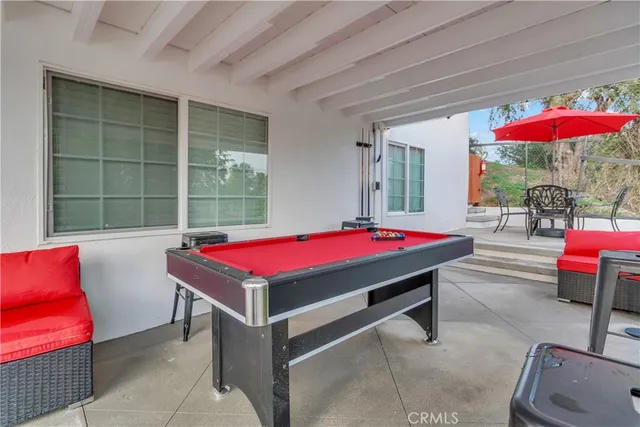 a room with pool table and pool table