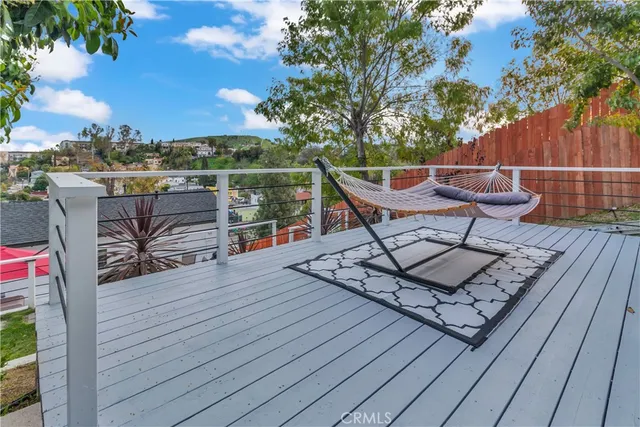 a view of a backyard with sitting area