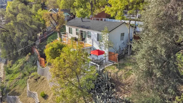 a view of a house with a tree