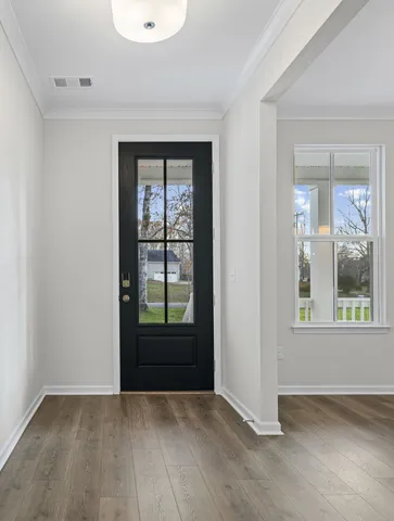 an empty room with windows and closet