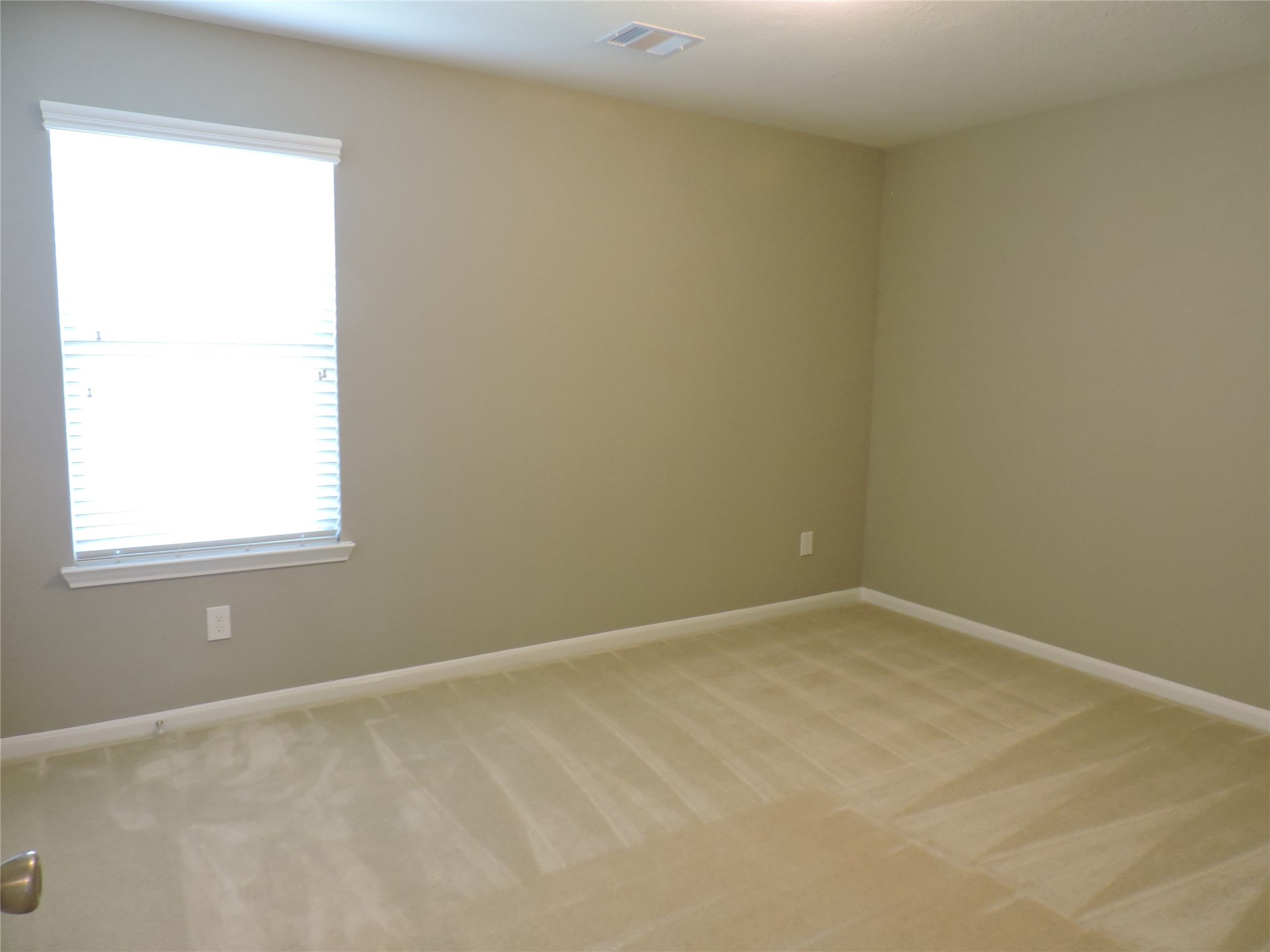 1102 Upton Court Conroe, TX 77304 - Photo 21 of 30 an empty room with a window