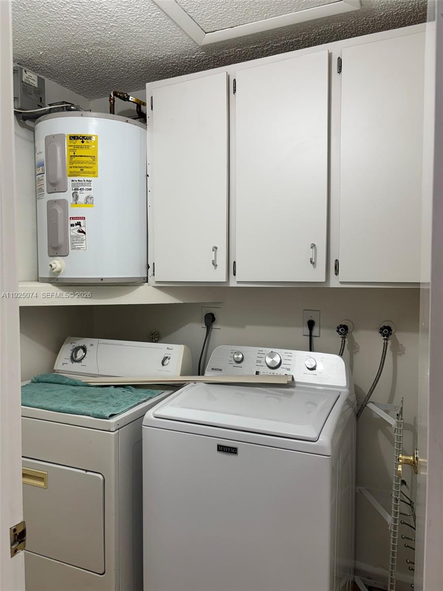 7331 Southwest 149th Court Miami, FL 33193 - Photo 11 of 25 a utility room with dryer and washer
