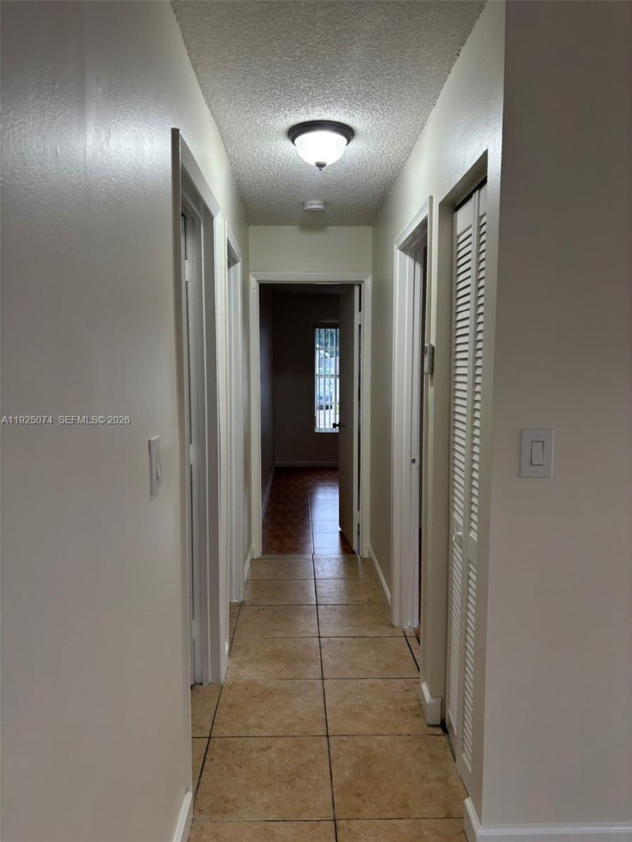 7331 Southwest 149th Court Miami, FL 33193 - Photo 12 of 25 a view of a hallway