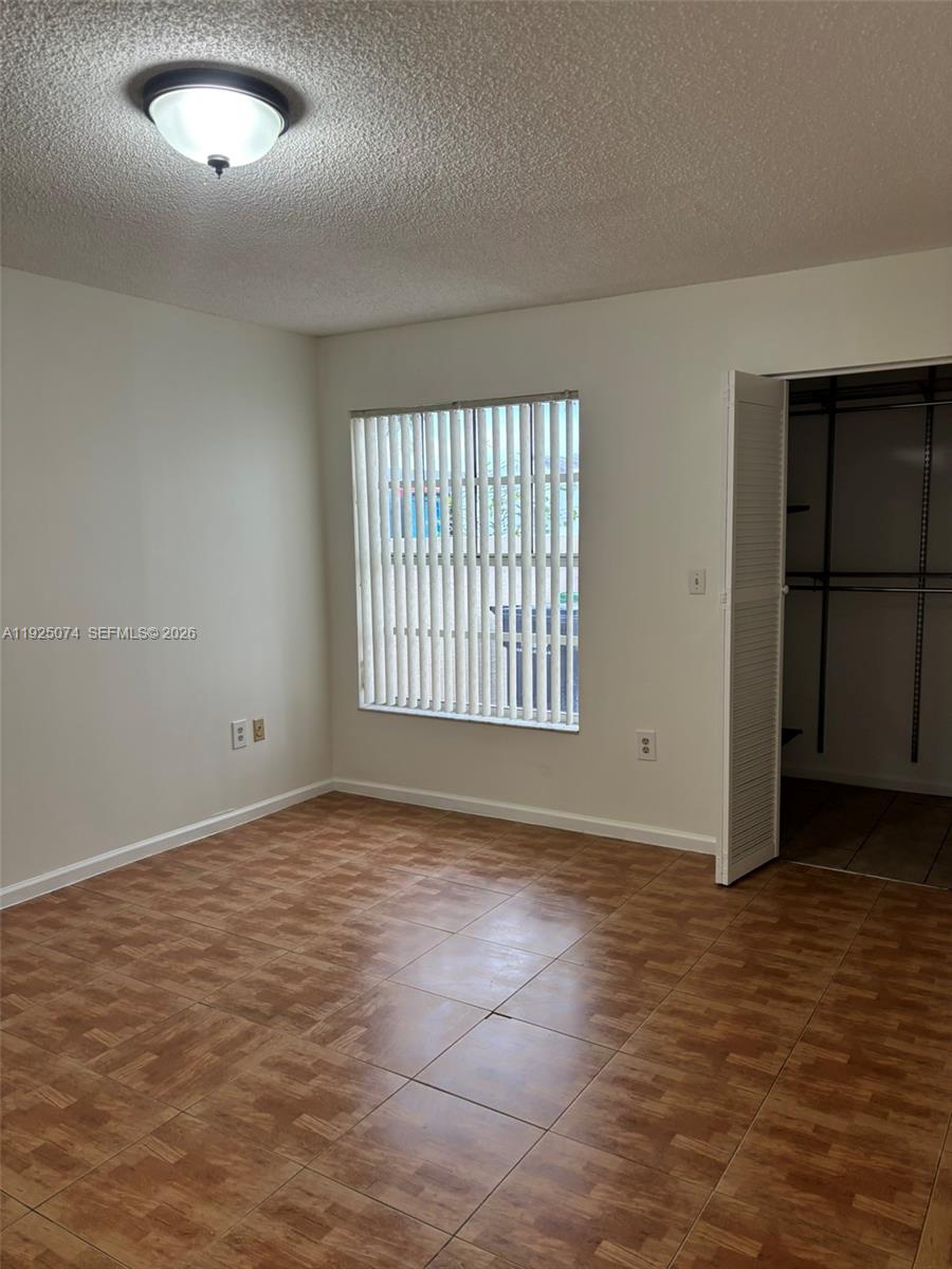 7331 Southwest 149th Court Miami, FL 33193 - Photo 17 of 25 an empty room with windows