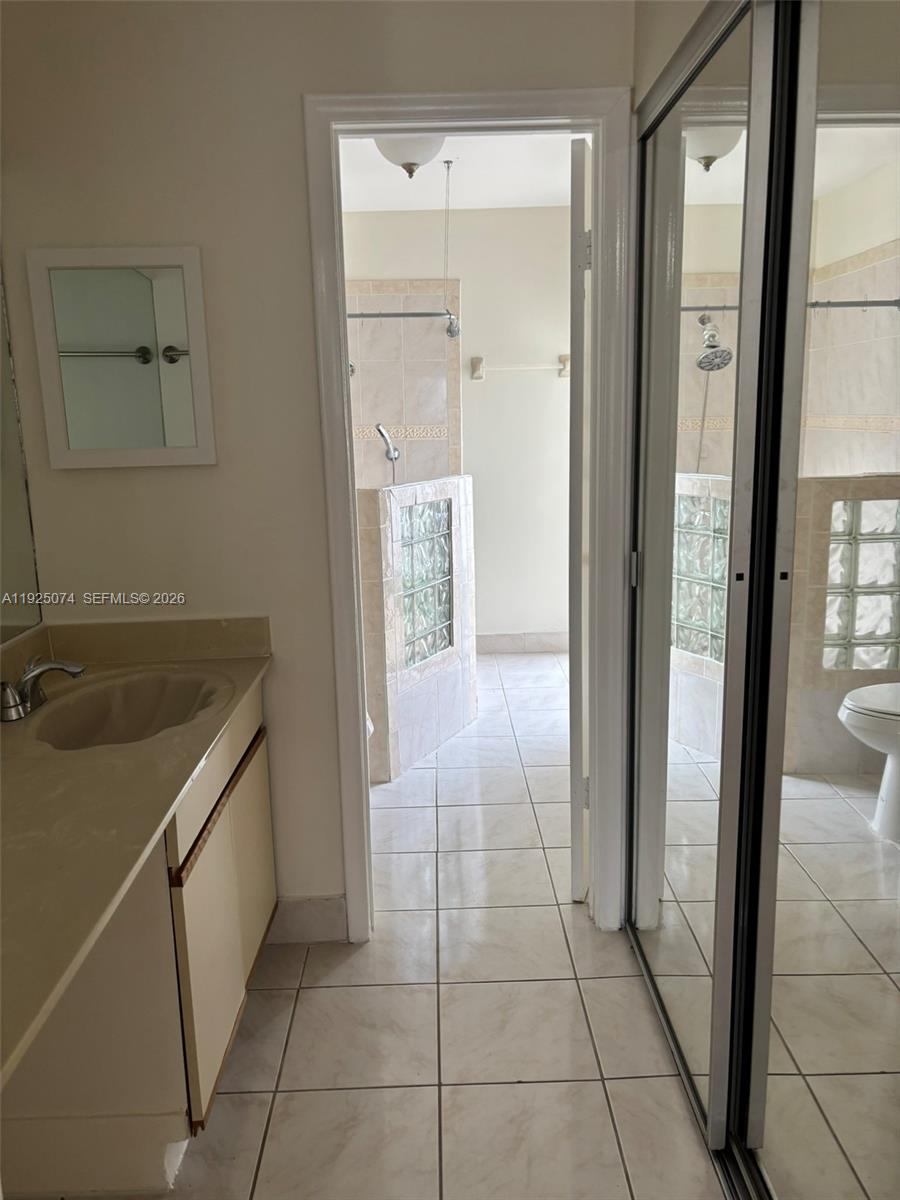 7331 Southwest 149th Court Miami, FL 33193 - Photo 19 of 25 a bathroom with a sink and a mirror