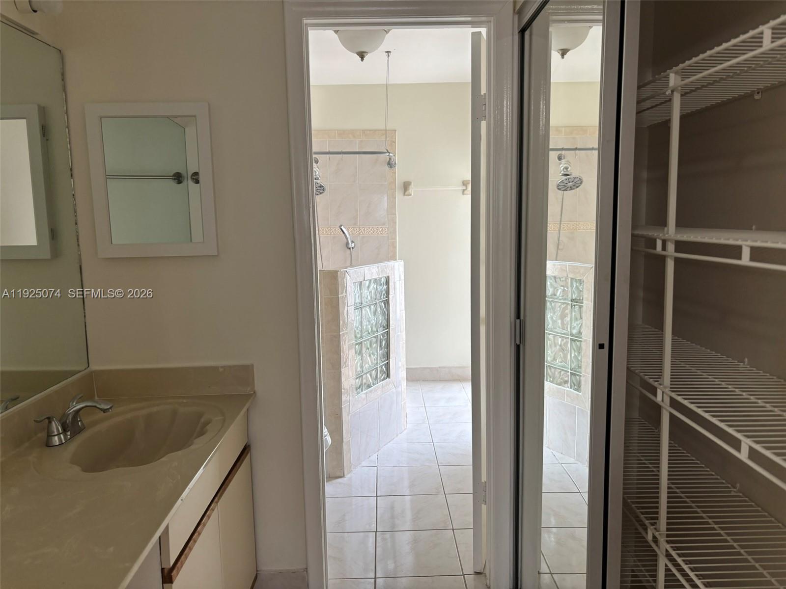 7331 Southwest 149th Court Miami, FL 33193 - Photo 20 of 25 a bathroom with a sink and a mirror