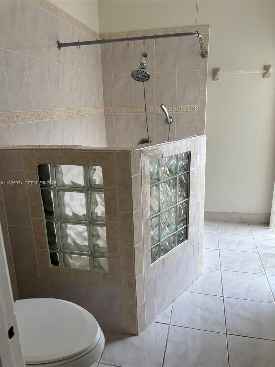 7331 Southwest 149th Court Miami, FL 33193 - Photo 21 of 25 a bathroom with a toilet and a shower