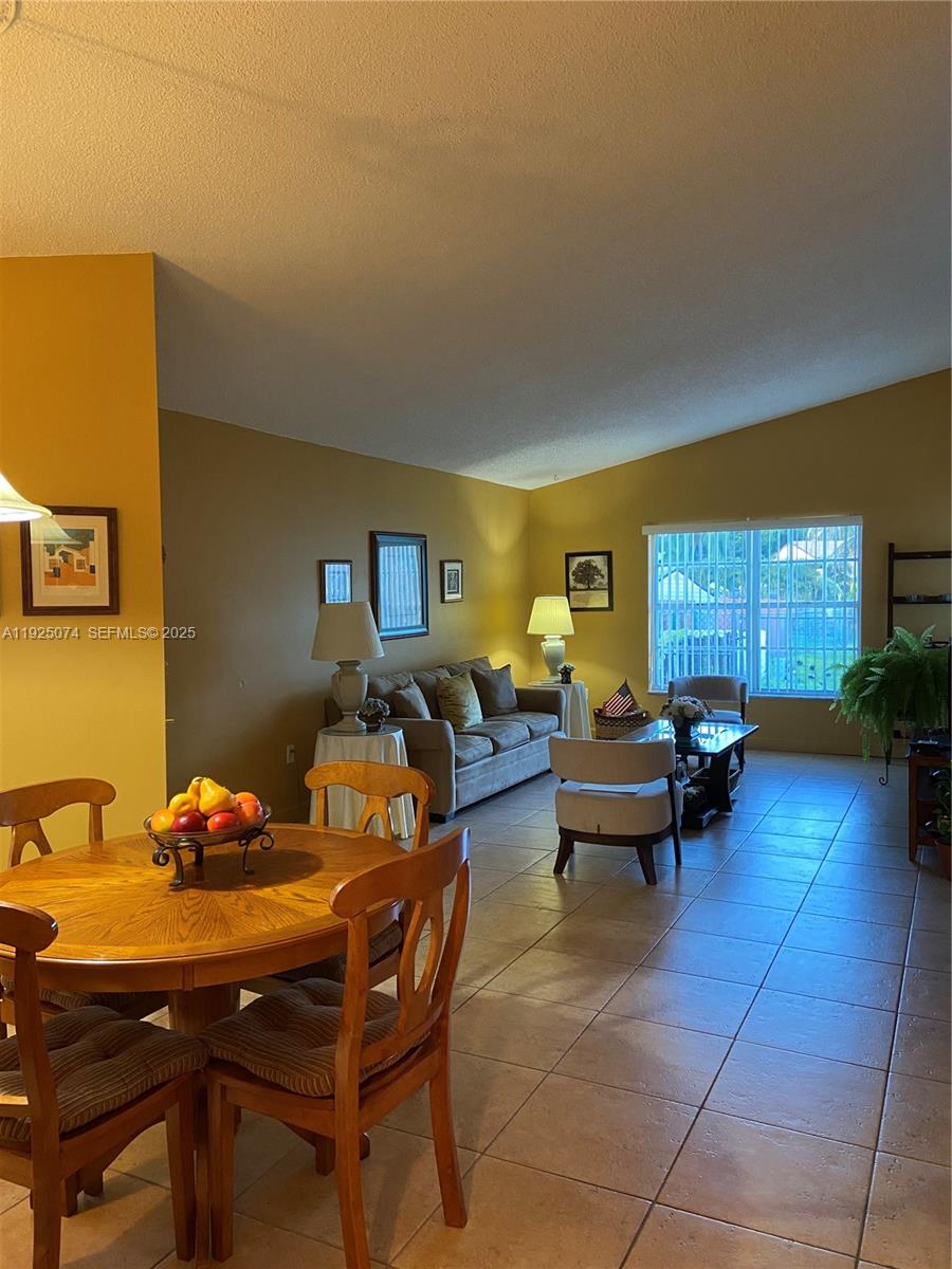 7331 Southwest 149th Court Miami, FL 33193 - Photo 4 of 10 a living room with furniture and a large window