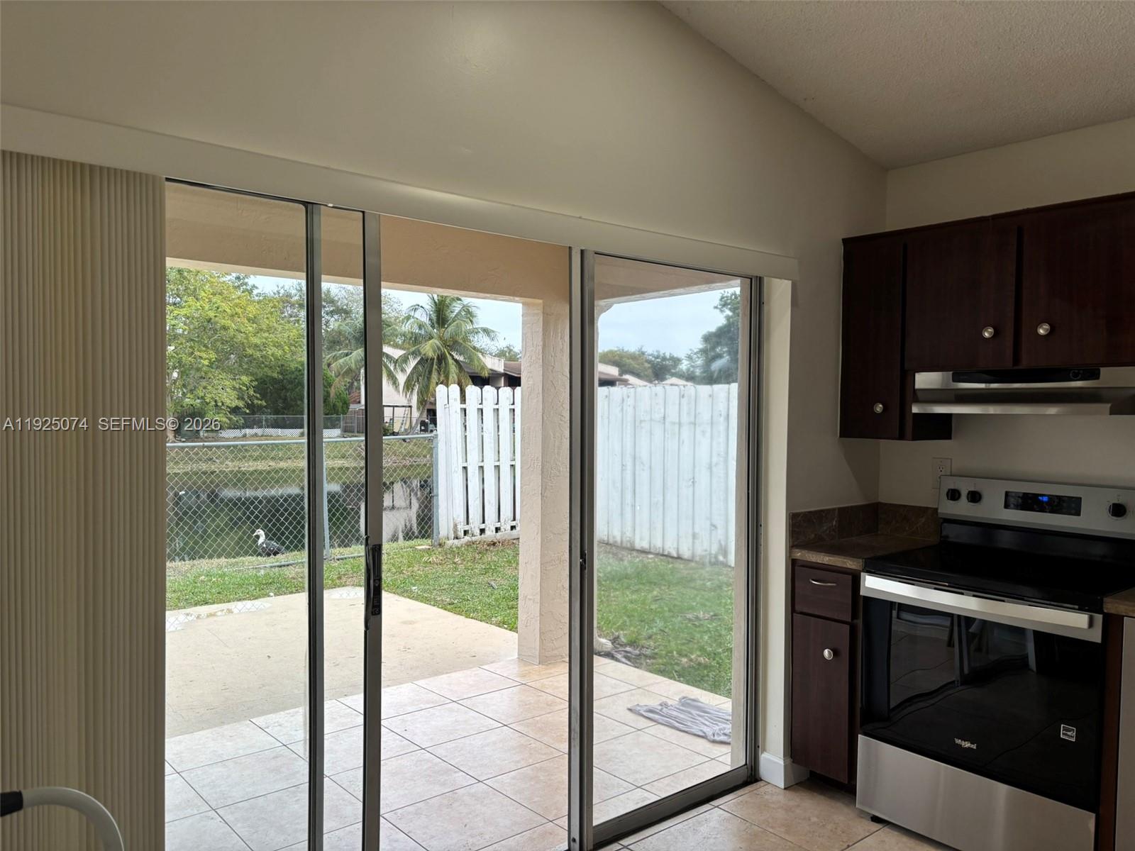 7331 Southwest 149th Court Miami, FL 33193 - Photo 6 of 25 a kitchen with a large window
