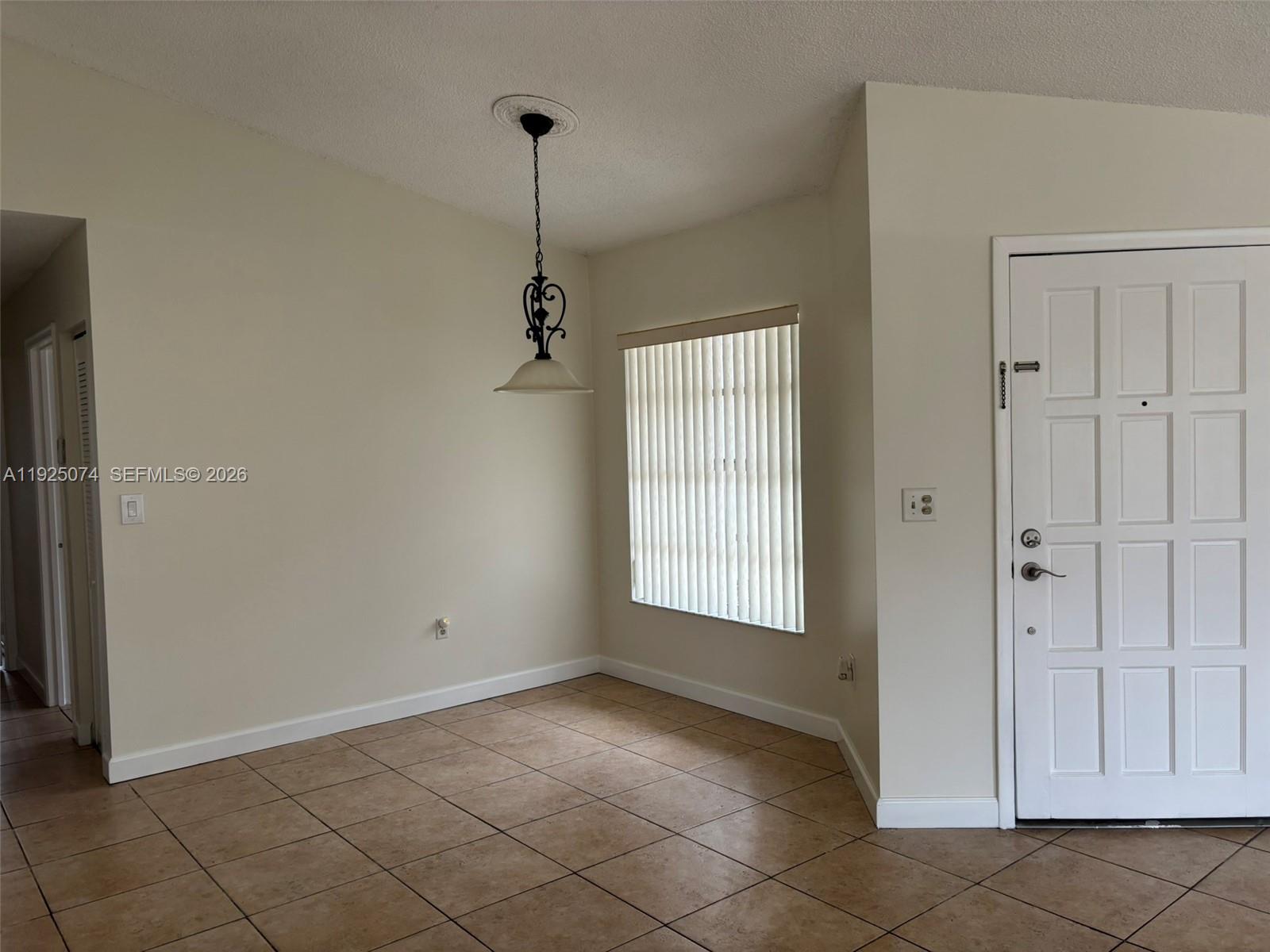 7331 Southwest 149th Court Miami, FL 33193 - Photo 7 of 25 a view of an empty room and window