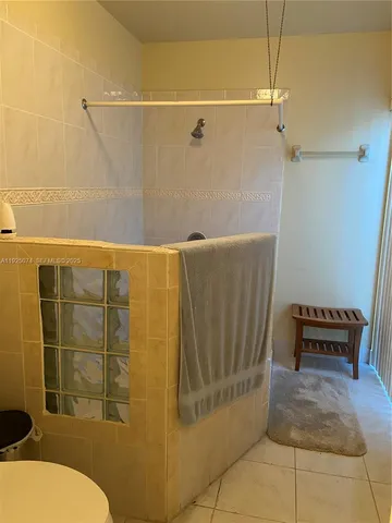 a bathroom with a toilet and shower
