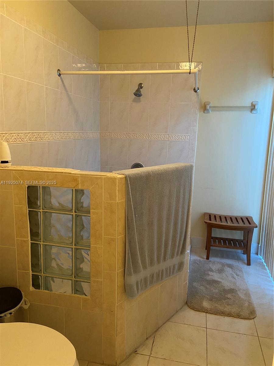 7331 Southwest 149th Court Miami, FL 33193 - Photo 7 of 10 a bathroom with a toilet and shower