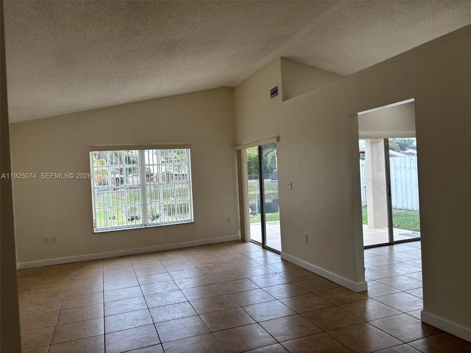 7331 Southwest 149th Court Miami, FL 33193 - Photo 8 of 25 a view of an empty room with a window