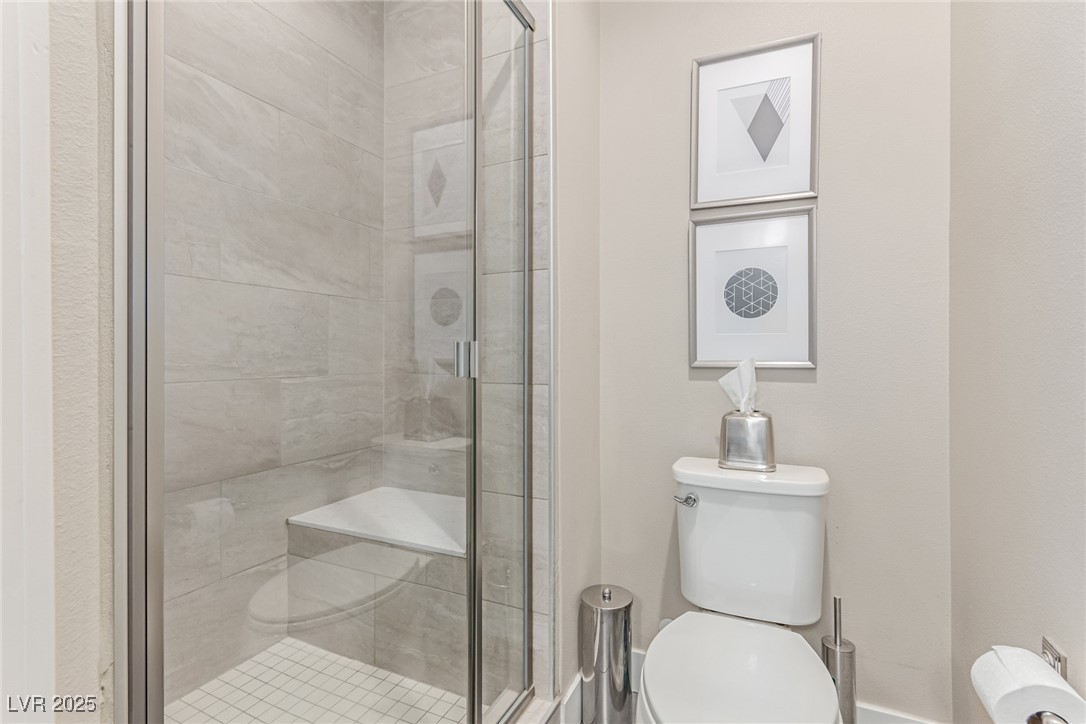 3165 Via Como Henderson, NV 89044 - Photo 16 of 42 Full bathroom featuring toilet and a shower stall