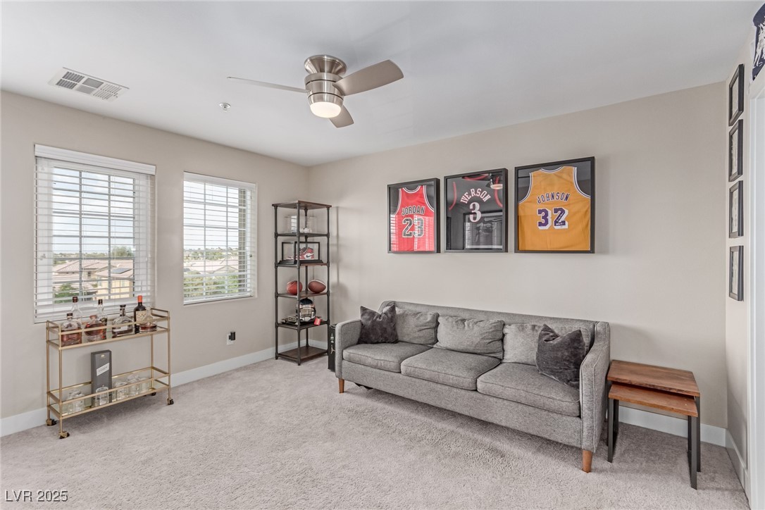 3165 Via Como Henderson, NV 89044 - Photo 17 of 42 Living room with ceiling fan, carpet flooring, and baseboards