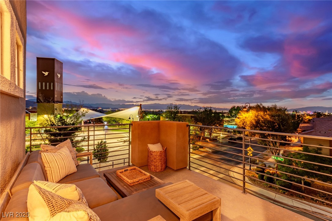 3165 Via Como Henderson, NV 89044 - Photo 2 of 42 Balcony at dusk with outdoor lounge area