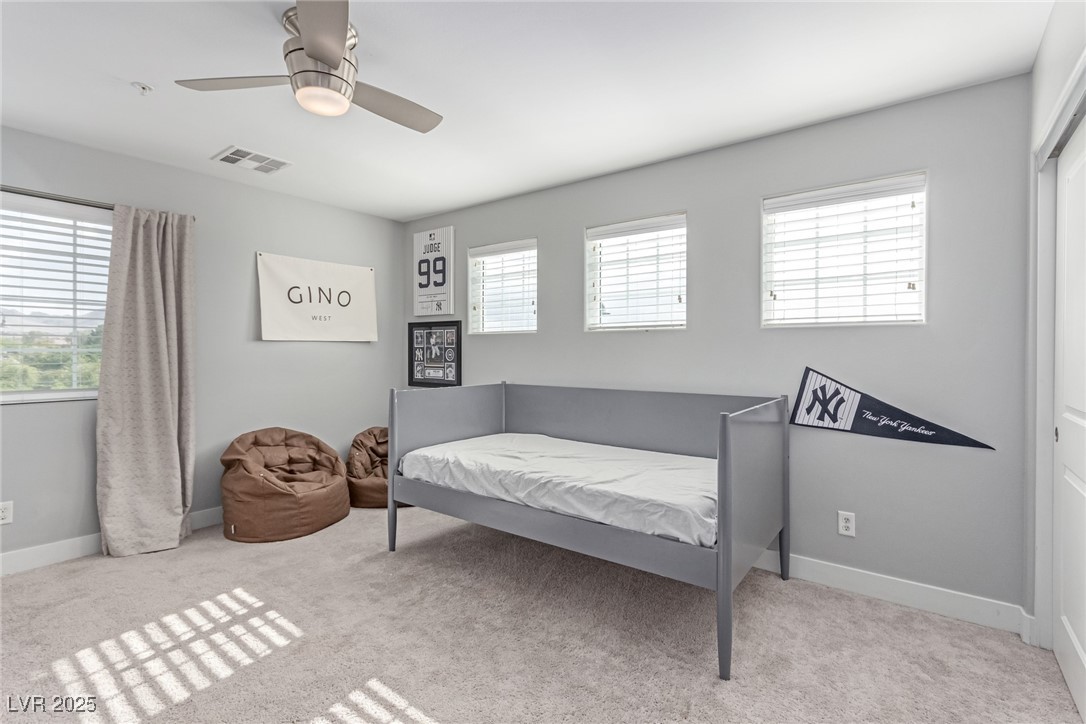 3165 Via Como Henderson, NV 89044 - Photo 24 of 42 Bedroom with carpet flooring, ceiling fan, and baseboards