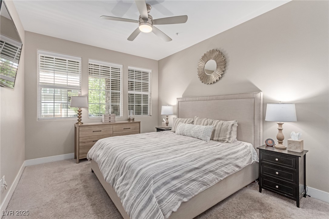 3165 Via Como Henderson, NV 89044 - Photo 34 of 42 Carpeted bedroom downstairs featuring baseboards and ceiling fan