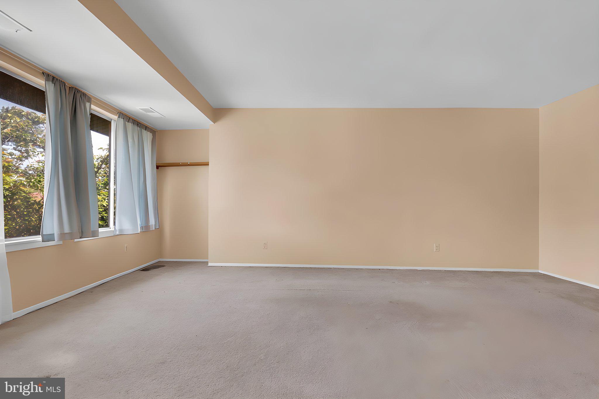 19309 Club House Road, Unit 19309 Gaithersburg, MD 20886 - Photo 10 of 24 an empty room with windows