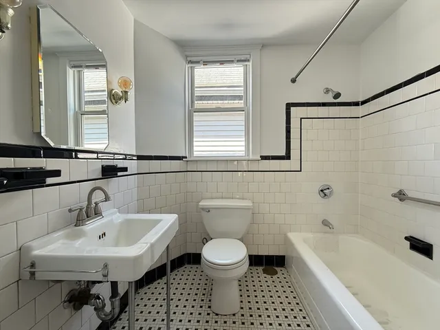 a bathroom with a sink toilet a shower and bathtub