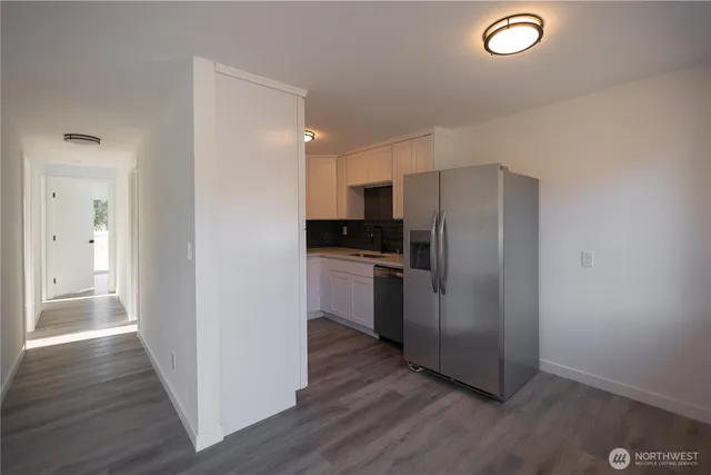 a kitchen with a refrigerator a sink and dishwasher