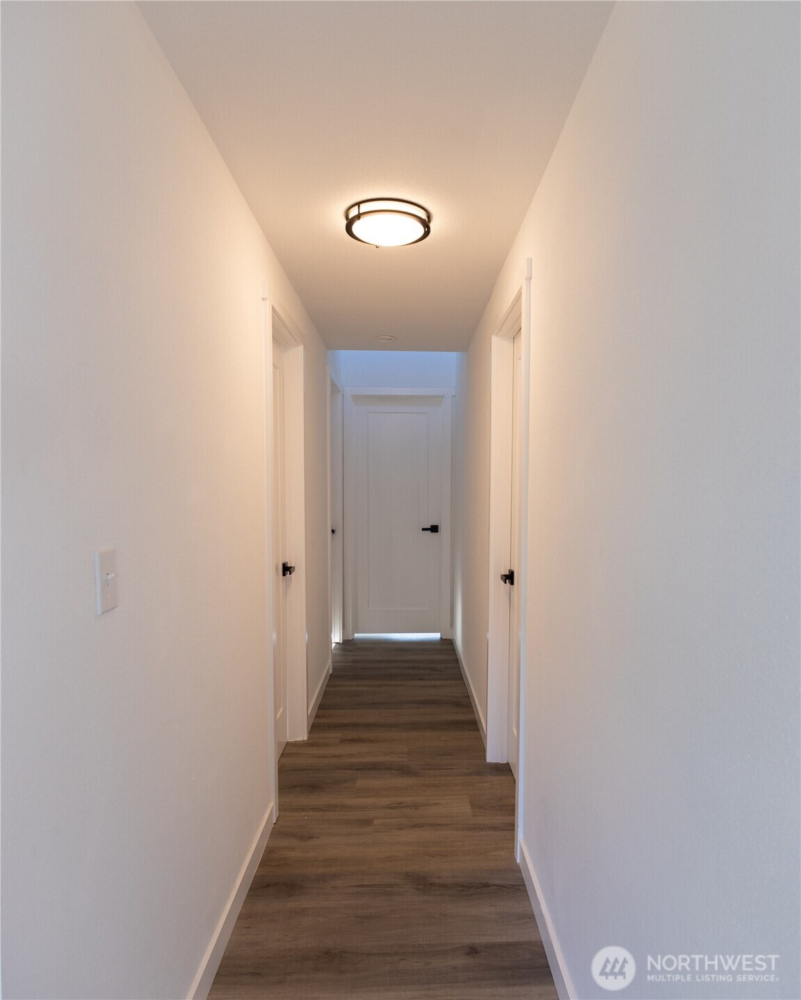 814 5th Street Steilacoom, WA 98388 - Photo 9 of 18 a view of a hallway with wooden floor