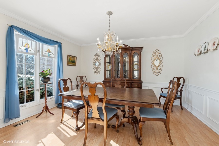 835 Highland Road Frankfort, IL 60423 - Photo 8 of 25 a view of a dining room with furniture window and wooden floor