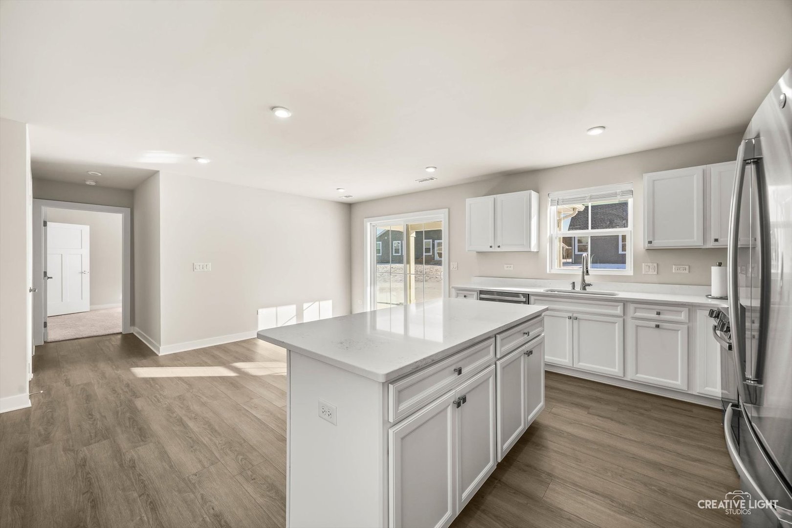 1237 Marigold Lane Hampshire, IL 60140 - Photo 15 of 34 a kitchen with granite countertop white cabinets and white appliances