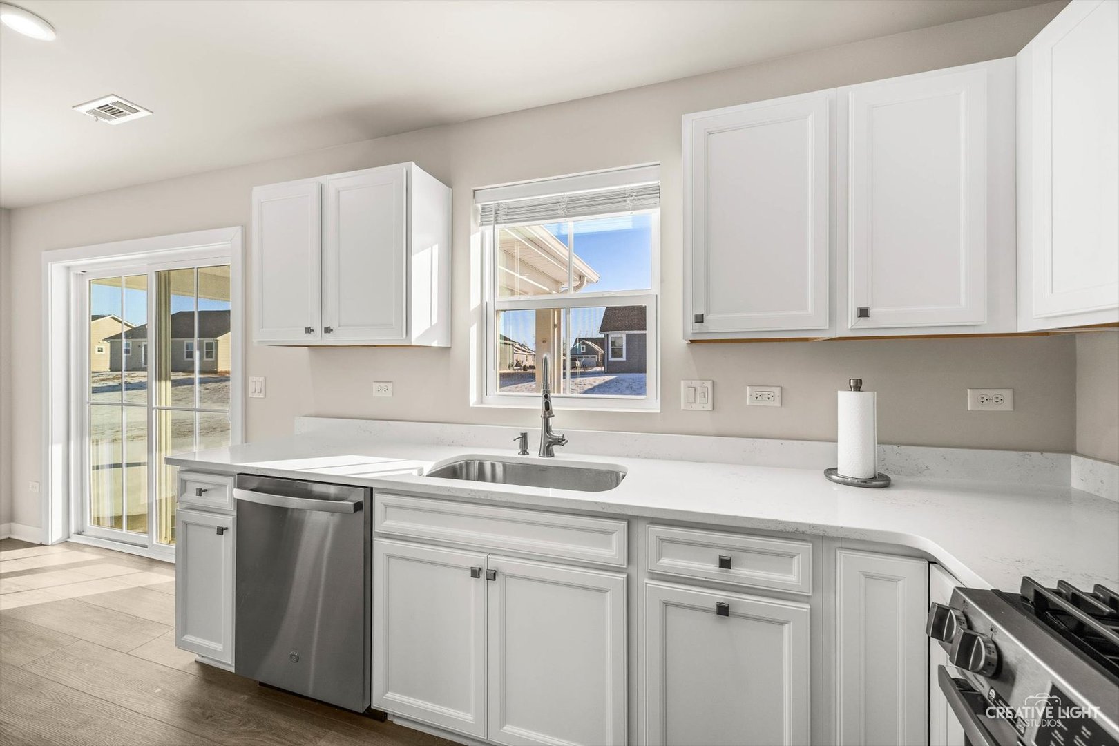 1237 Marigold Lane Hampshire, IL 60140 - Photo 16 of 34 a kitchen with white cabinets and white appliances