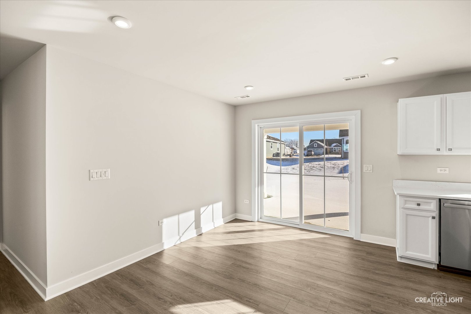 1237 Marigold Lane Hampshire, IL 60140 - Photo 18 of 34 an empty room with wooden floor and windows