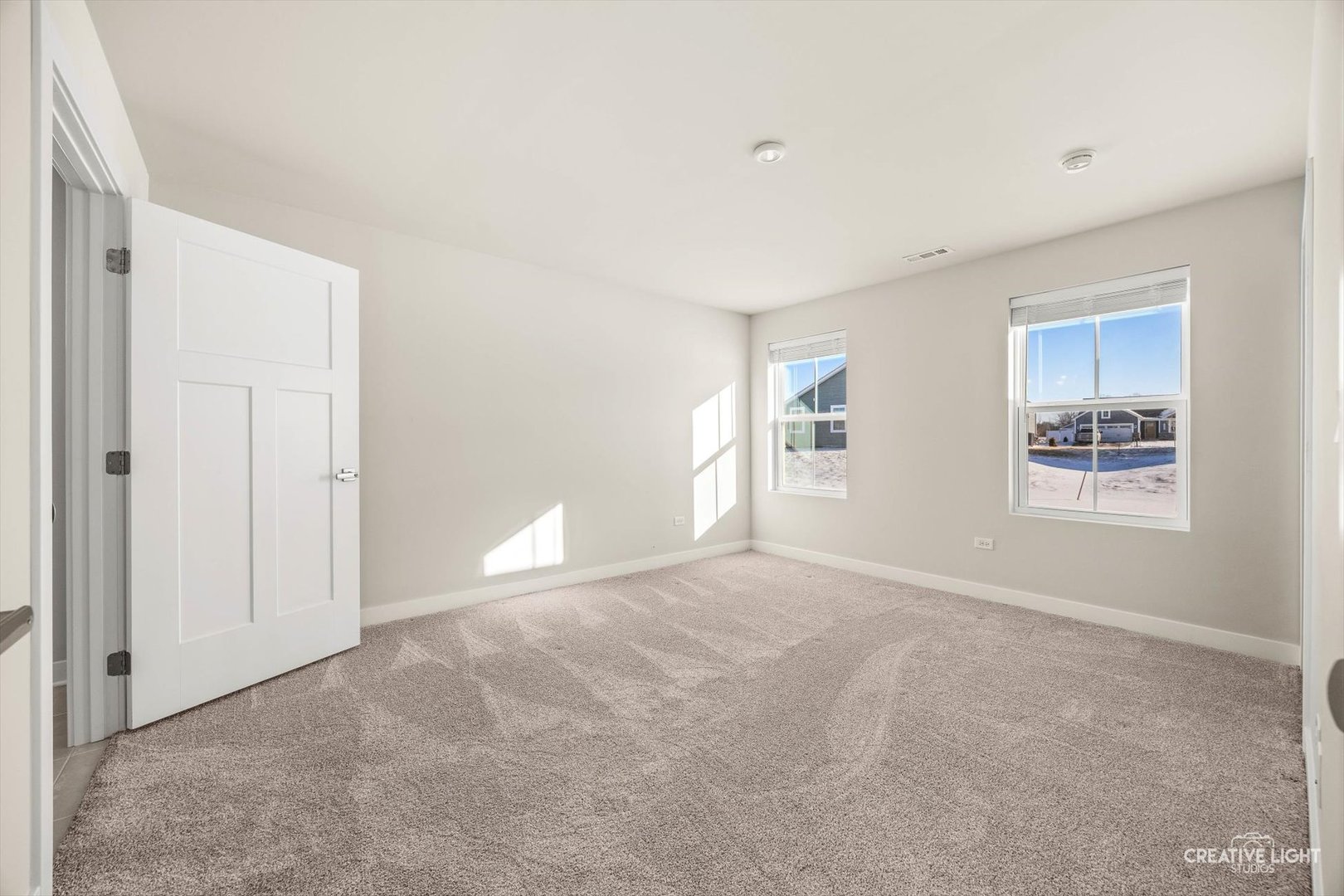 1237 Marigold Lane Hampshire, IL 60140 - Photo 21 of 34 a view of empty room with windows