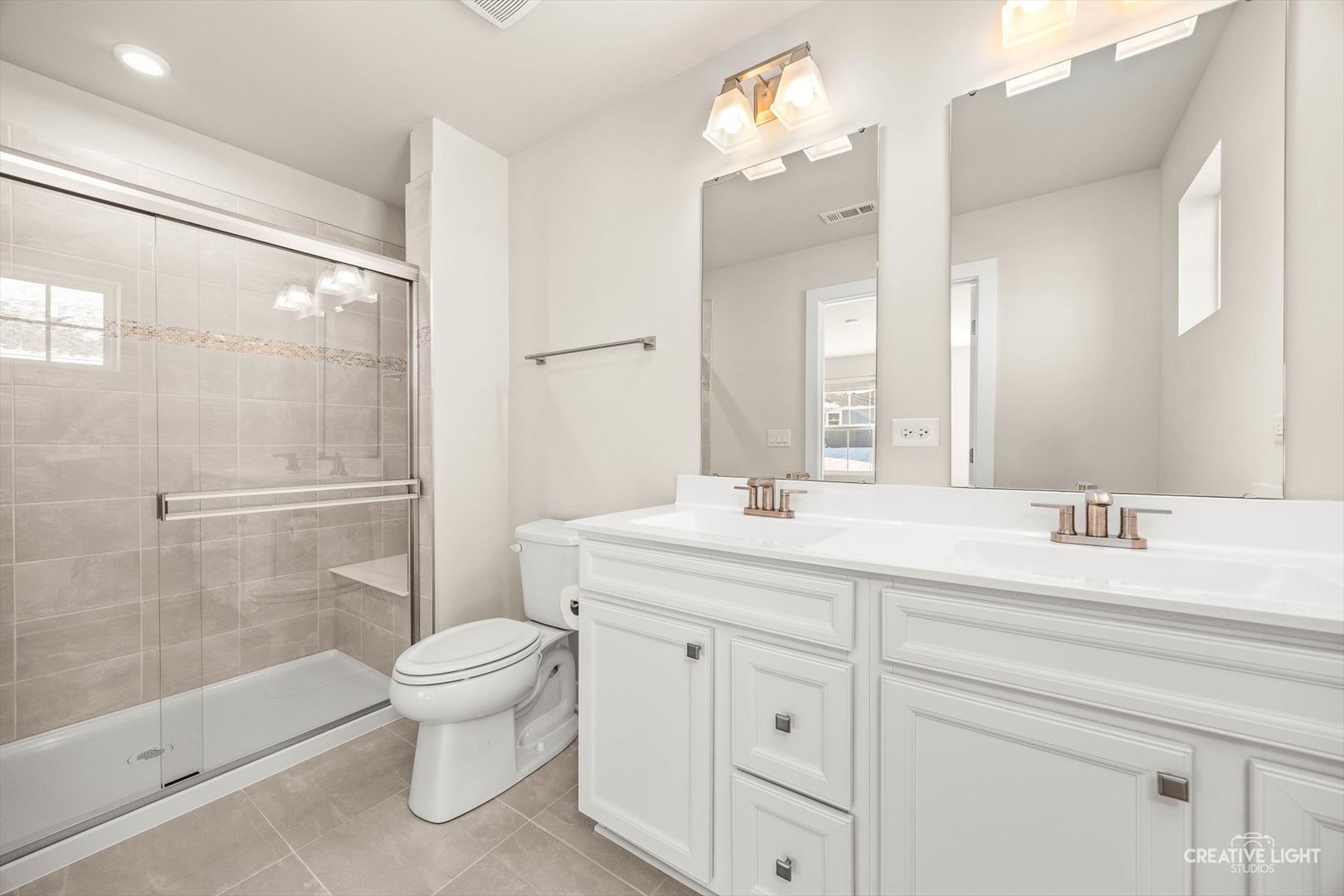 1237 Marigold Lane Hampshire, IL 60140 - Photo 24 of 34 a bathroom with a granite countertop sink a toilet a mirror and shower