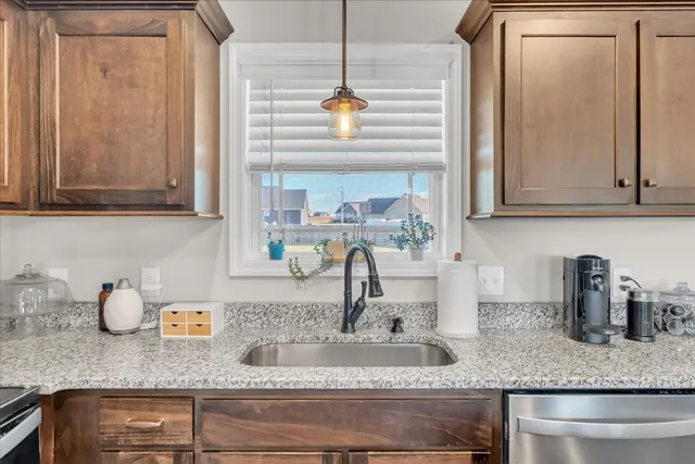 a kitchen with sink and window