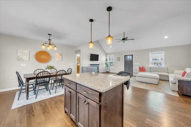 a view of kitchen island with furniture and wooden floor