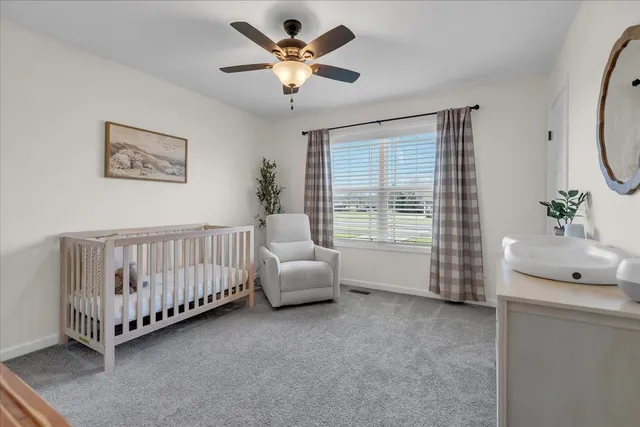 a bedroom with furniture and windows